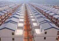 Китайские жители переехали в новый город, похожие на блоки тюрьмы