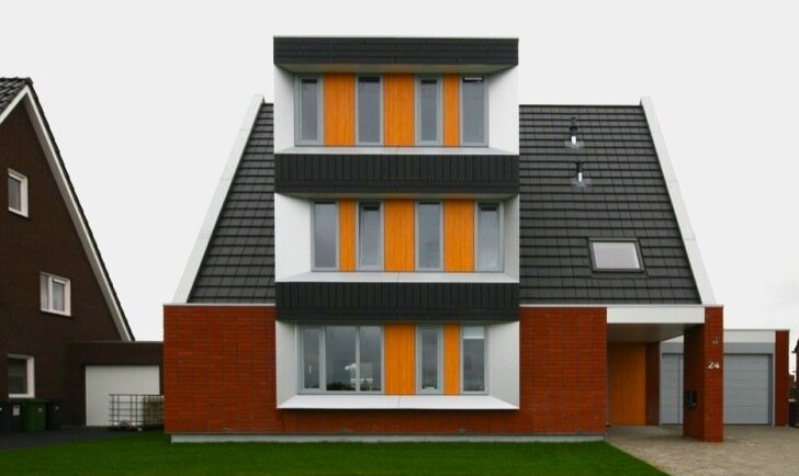 Маленький голландский дом остается теплой с пассивным дизайном.